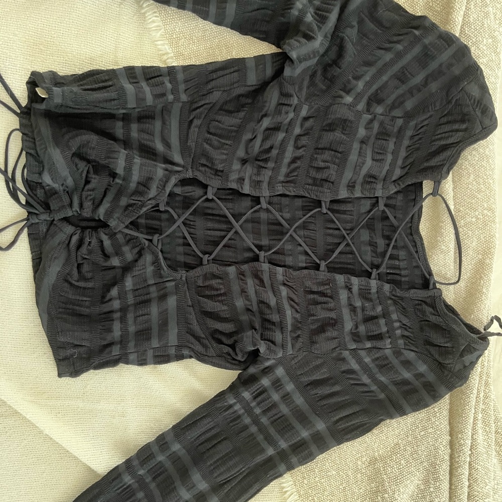 Free People black long sleeve with tie back. Size M.